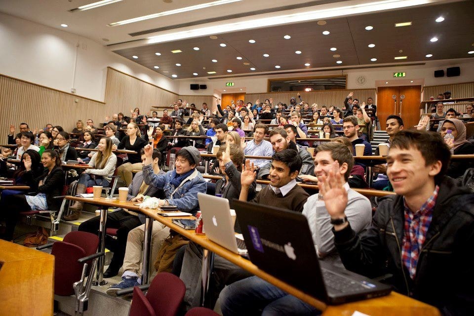 Multiracial professionals attending career development seminar